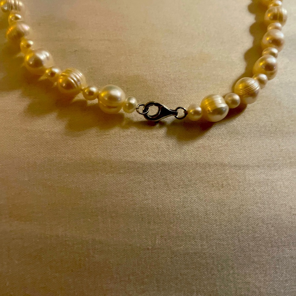 Pearl necklace inherited from my aunt who encouraged continued education.